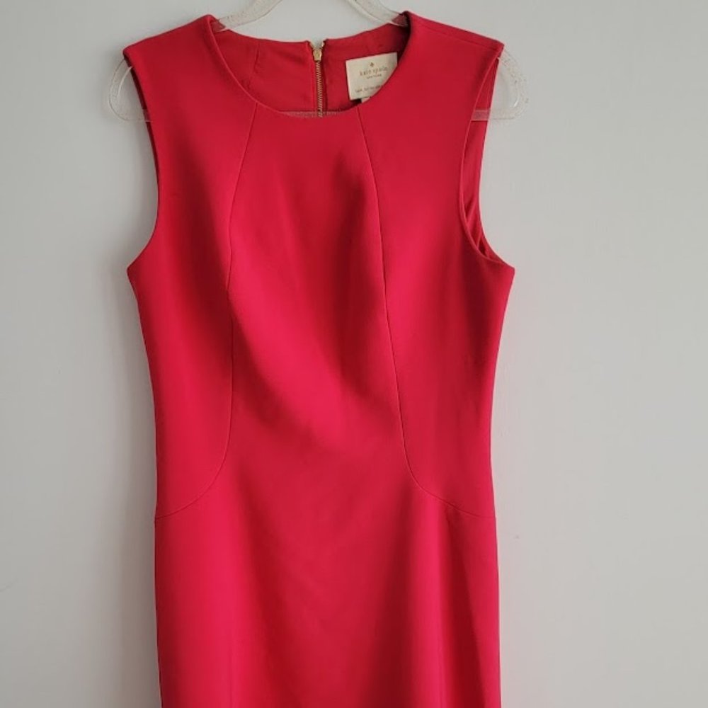 This is the “Sicily” Peach A-line crepe dress by Kate Spade in size 14.